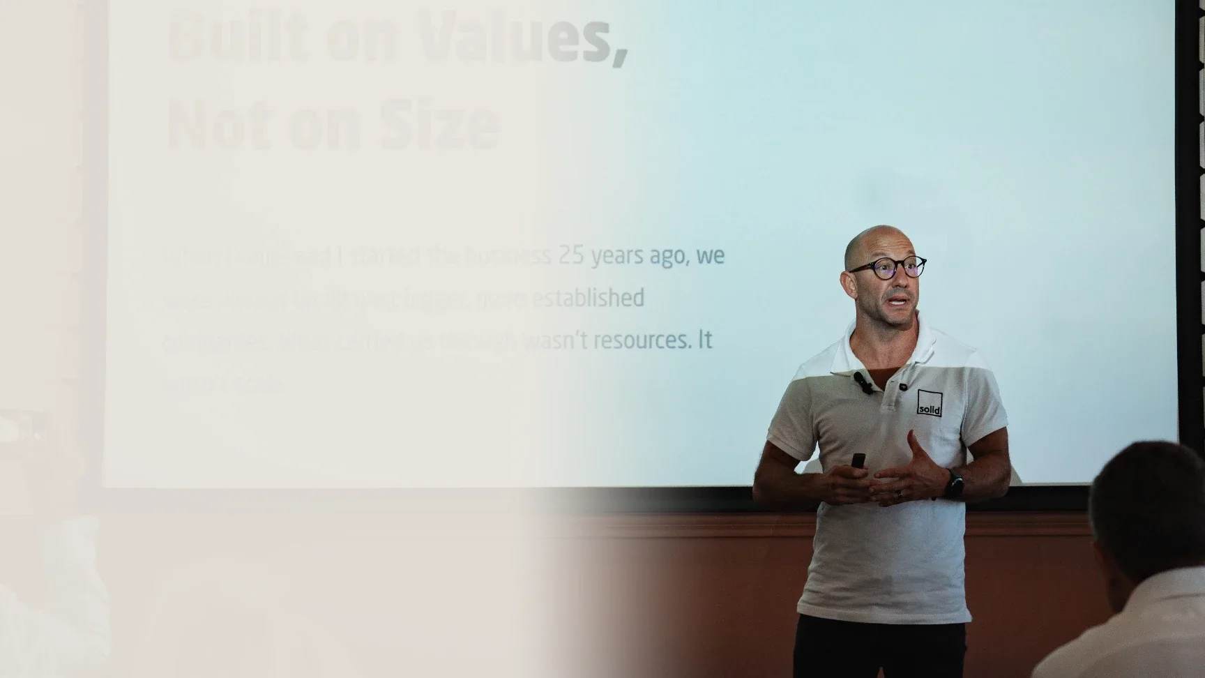 Michael Claxton, co-founder of Solid Systems, presenting to a group of leaders