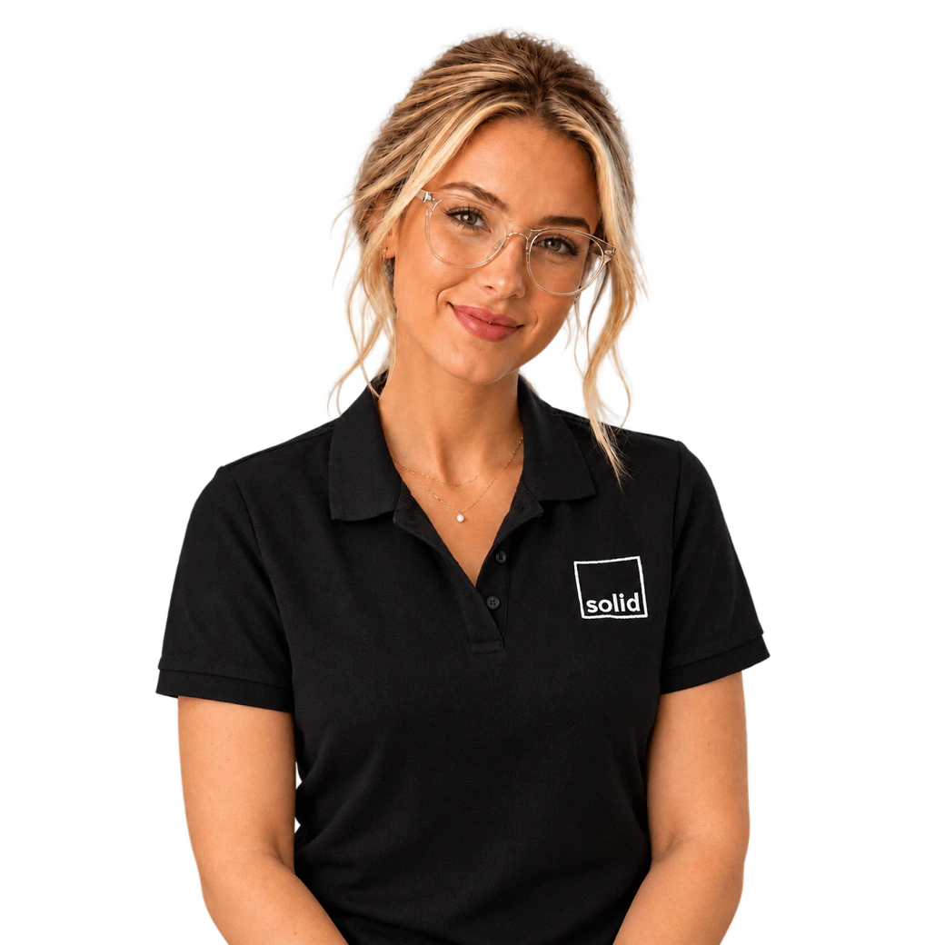 Alice from the Solid Systems team, smiling in a Solid polo shirt