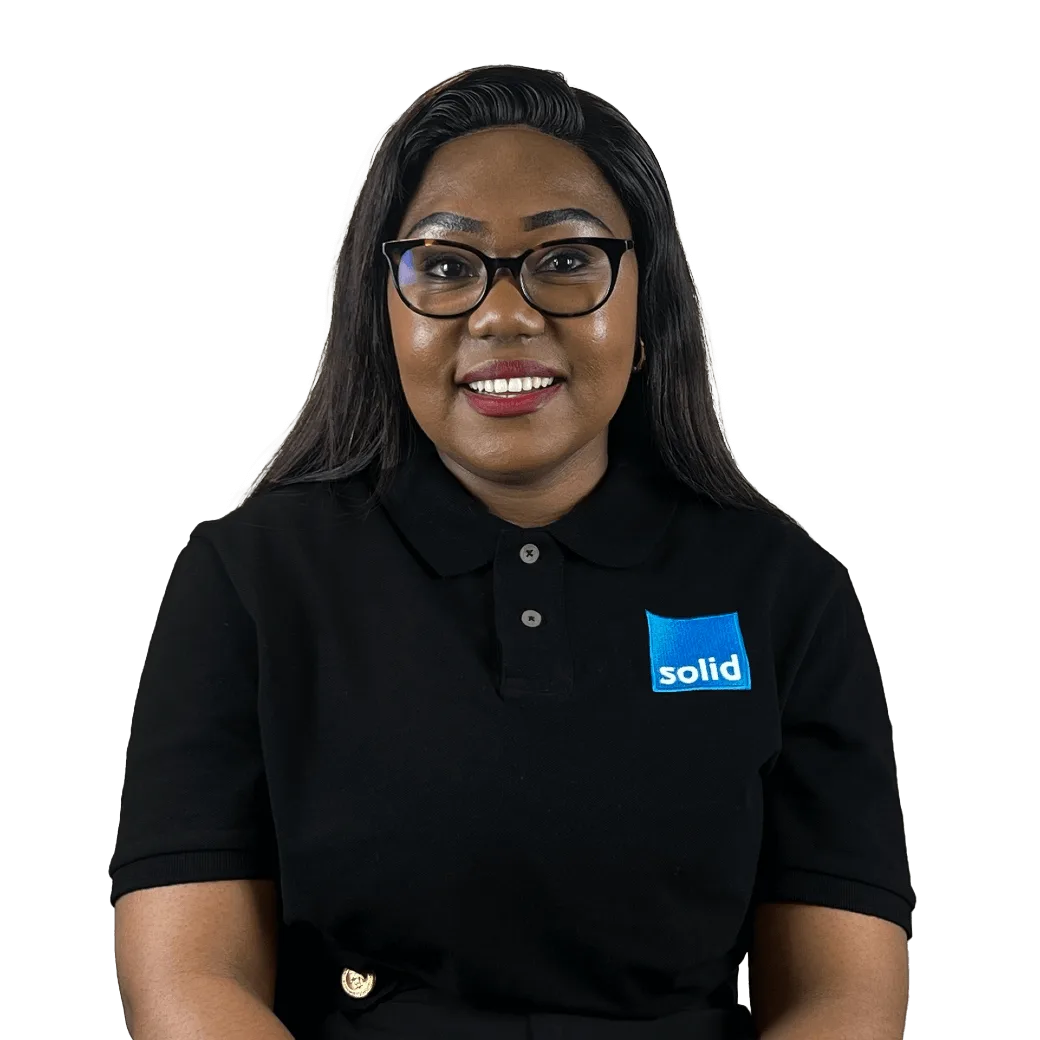 Gugu from the Solid Systems team, smiling in a Solid polo shirt