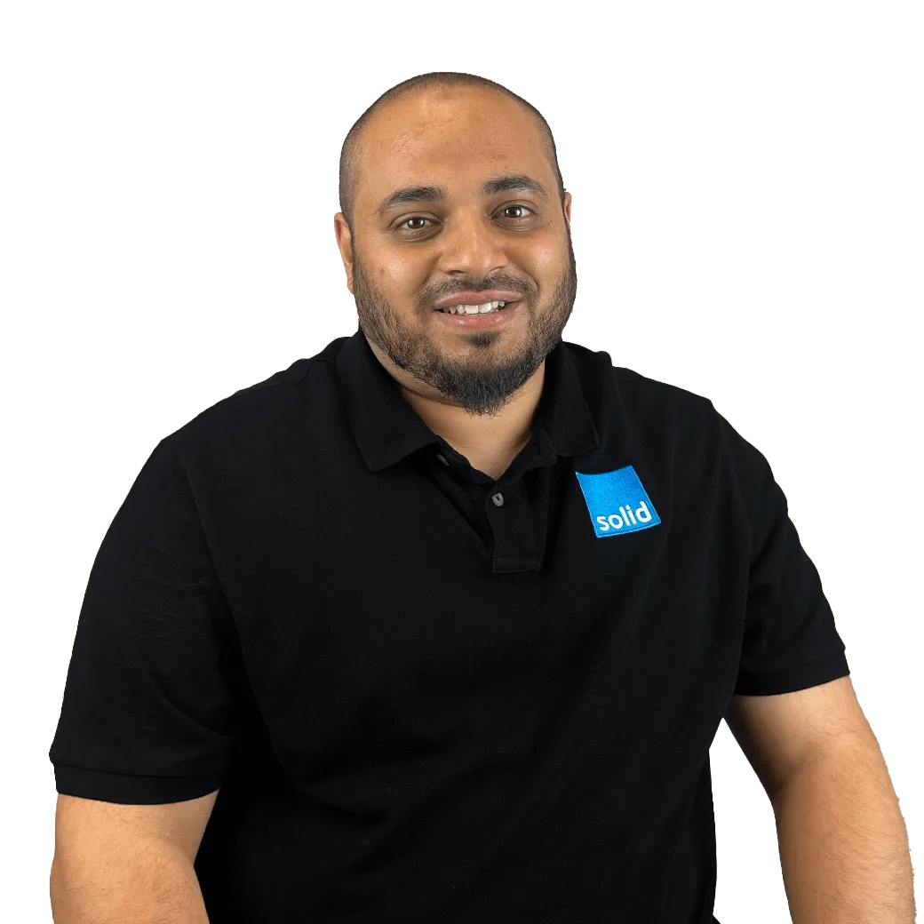 Irfaan from the Solid Systems team, smiling in a Solid polo shirt