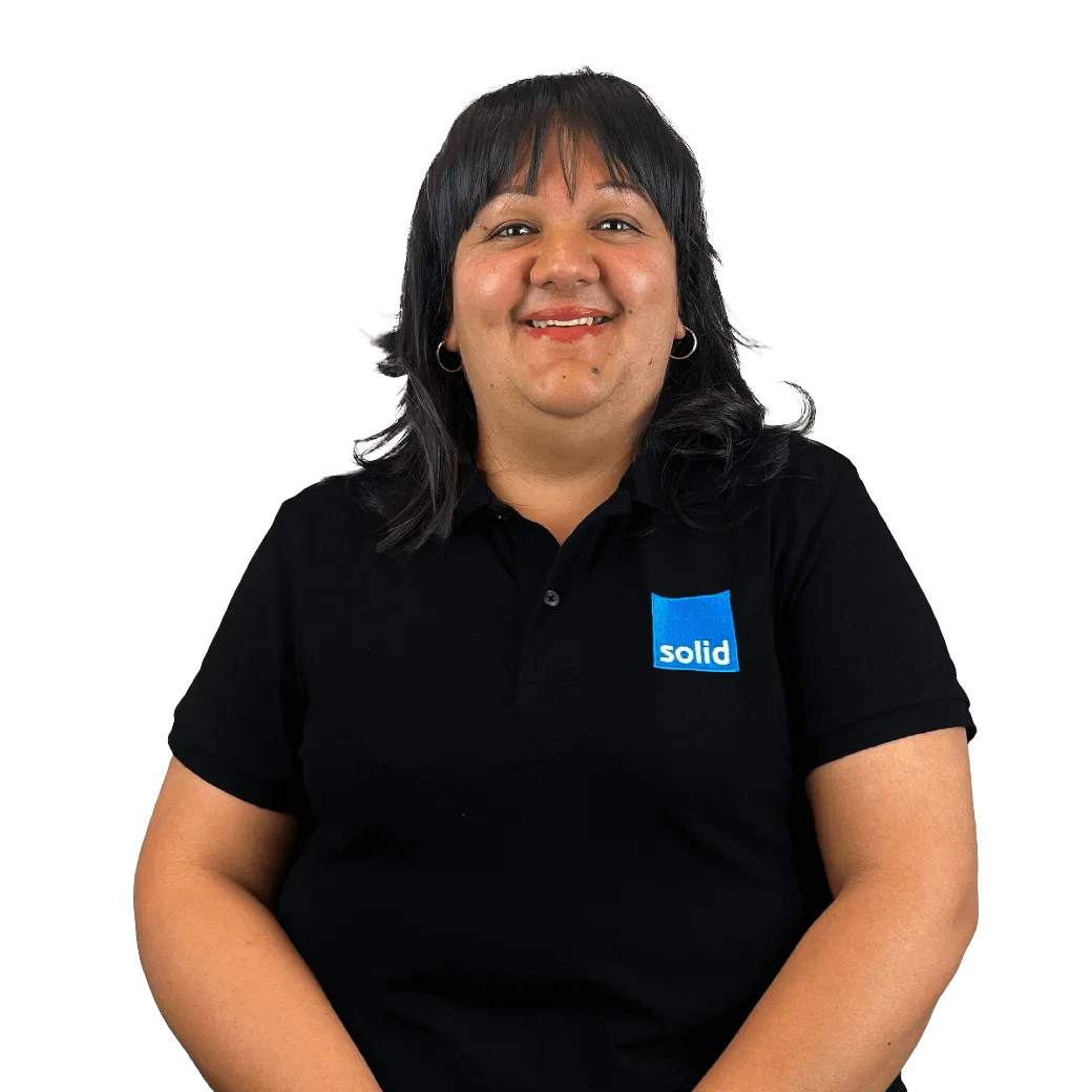 Melecia from the Solid Systems team, smiling in a Solid polo shirt