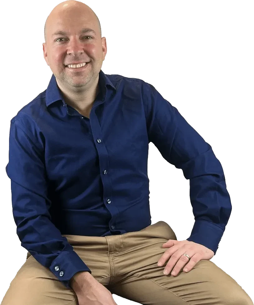 Daniel Avinir, co-founder and CEO of Solid Systems, smiling in a navy shirt